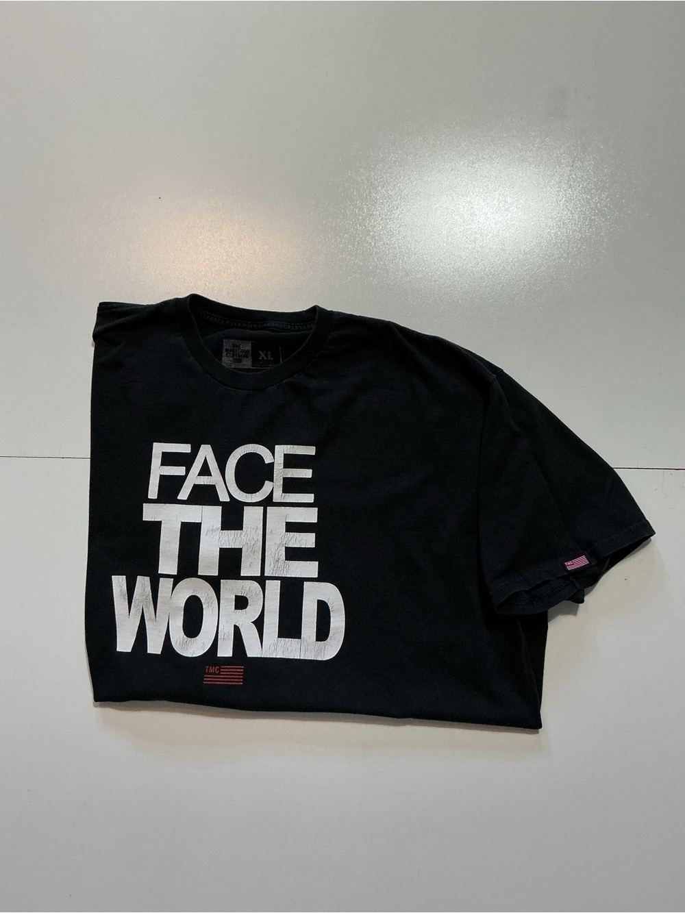 TMC The Marathon Clothing Face The World Nipsey Hussle Black Graphic T-Shirt